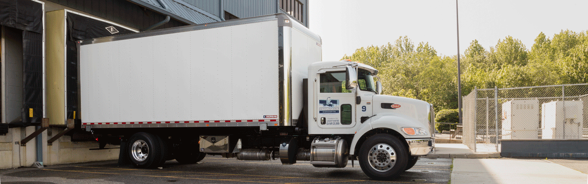 GIF d'animation montrant une carrosserie de camion en train d'être levée d'un châssis et le détachement du camion