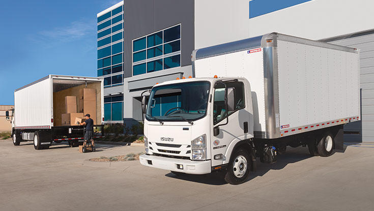 Front 3/4 view of Fastrak Dry Freight truck backed into a loading dock